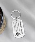 Gearhead Mechanical Engineer Gift Keychain For Students And Pros - Inspirational Engineering Charm For Graduation, Christmas, Or Birthday, stainless steel pendant with engraved text, on soft fabric surface.