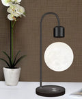 Floating Moon Lamp With Built In Qi Wireless Charger Modern Levitating Light With Touch Control for a warm ambience night light in room setting.