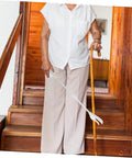 Long Reach Grabber Tool For Seniors 28 Inch Portable Reacher With Non Slip Grip And Stainless Steel Claw Ideal For Kitchen Balcony Home Care Travel The Ultimate Helper For Everyday Tasks At Home And On The Go. elderly woman using 28-inch white grabber on stairs