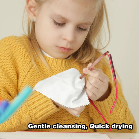 Eyeglass lens wipes with pink-wrapped packaging and a white microfiber cloth