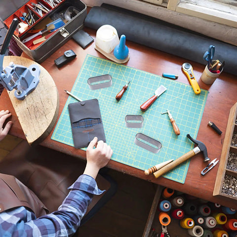 Person using Leather Die Punch Cutter Set in Steel with Hollow Punch Tools on crafting table, Cutting Mold Punching Kit visible