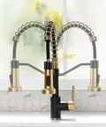Close-up of Badass Matte Black Kitchen Faucet With Sleek Gold Accent Pull Down Sprayer, 360° swivel, ideal for farmhouse sinks.