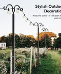 Outdoor setting with Two Pack String Light Poles With Seven Prong Steel Construction in a garden with lights and trees