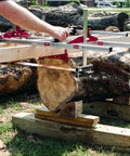 Chainsaw Mill With Lumber Guide Brackets Portable Sawmill Kit Converts Into Three Sizes For Independent Use Fits 14 To 36 Inch Planking Bar No Fuss Setup Durable Aluminum And Steel Cut Guide Set being used to cut lumber.