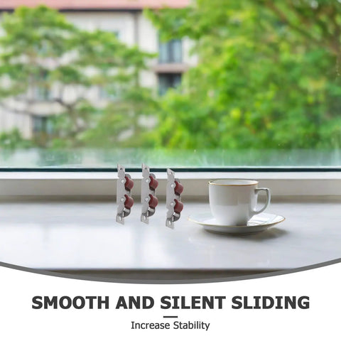 Four Piece Sliding Door Rollers With Double Wheel Bearing Track Pulleys For Smooth As Butter Glide on a windowsill with cup.