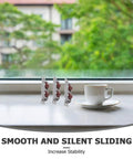 Four Pack Heavy Duty Stainless Steel Double Wheel Sliding Door Roller Assembly With A Slick Polished Finish and Rock Solid Wear Resistant Pulleys displayed on a window sill.