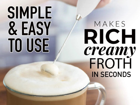 Complete Home Coffee Frother Set With Upgraded Ultra Stand Barista Grade Handheld Milk Foam Maker whisking frothy milk in cup
