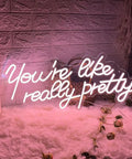 You Are Like Really Pretty Neon Light Sign Peach Pink LED Neon Wall Decor for Bedroom with floral accent on white fur backdrop