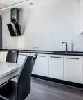 Modern kitchen with matte black 10 inch square cabinet pulls for kitchen cabinets and drawers, sleek white and black design.