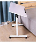 Adjustable Rolling Laptop Table With Slick Brake Wheels Easy Glide Mobile Workstation Desk For Bedroom Living Room Sofa Overbed setup next to bed.