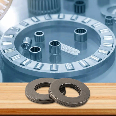 Thinking Process: AXK1528 thrust needle roller bearing with hardened steel washers and needle cage on wooden surface