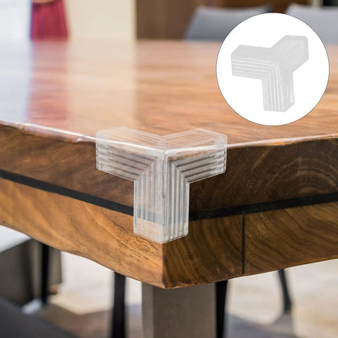 Close-up of a clear soft PVC edge protector on a wooden table corner, part of the 10 Pack Table Corner Guards For Kids And Pets.