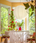 Jumbo White Paper Lantern 30 Inch Indoor Decor For Large Rooms Elegant Reusable Accordion Style Lighting Ideal For Parties And Events Ceiling Decor Showstopper Vibe Party Ready hanging above a table in a sunny room.