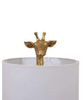 Distressed Gold Giraffe Table Lamp With White Linen Shade, Playful Resin Animal Accent peeking over lamp, ideal decor detail shot.