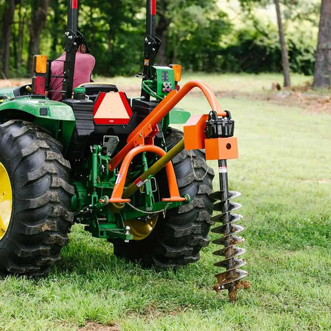 Beefy 30HP Standard Series 3 Point Post Hole Digger For Cat 1 Tractors in action on grass with auger attached to rear.