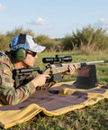 Person using Combo Front And Rear Shooting Rest Bag With Soft Leather Upper And Durable Canvas Base in outdoor setting