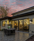 Modern home with Dusk To Dawn Exterior Wall Lights With Built In Sensor, illuminating backyard with outdoor seating area.