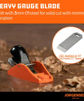 Jorgensen No.101 mini wood planer, front view; orange body with black handle and wood shavings