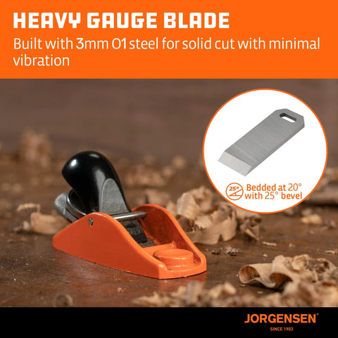 Jorgensen No.101 mini wood planer, front view; orange body with black handle and wood shavings