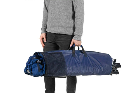 Man holding portable foldable metal framed hammock with cup holder and built-in storage pocket for camping, freestanding, blue