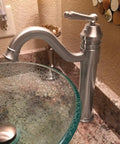 Century Single Lever Vessel Faucet in Brushed Nickel with Dope Solid Brass Build next to a glass vessel sink