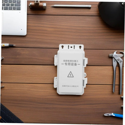Heavy Duty Waterproof Junction Box For Outdoor Electrical Circuits With UV Resistant Plastic Enclosure on wooden desk.