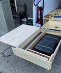 Heavy Duty Drawer Slides With Lock, 10 to 60 Inch Range, 500 Lb Capacity in a wooden drawer with storage, side view.