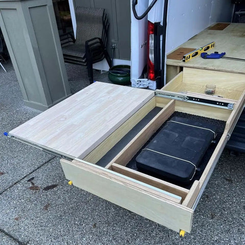 Heavy Duty Drawer Slides With Lock, 10 to 60 Inch Range, 500 Lb Capacity in a wooden drawer with storage, side view.
