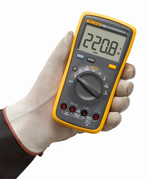Person holding a digital multimeter for electrical projects with AC and DC voltage and current measurement up to 1000V and 10A