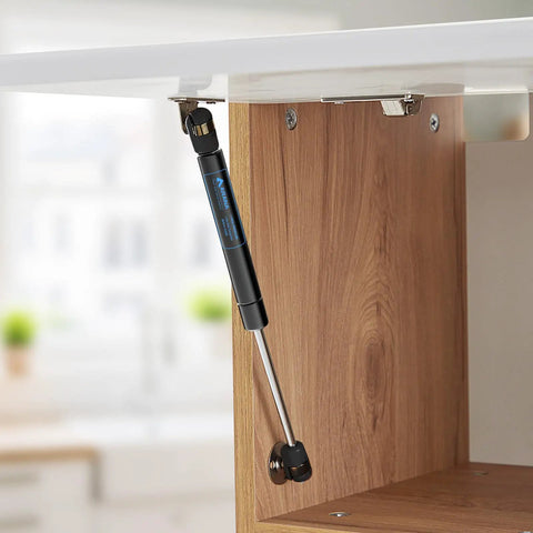 Gas Struts 10 Inch 33 Lb With Brackets Heavy Duty Lift Supports installed in a wooden kitchen cabinet lid open position
