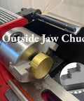 Heavy Duty 3 Piece Outside Lathe Chuck Set Featuring Self Centering Mini External Jaws on lathe with brass stock in jaws.