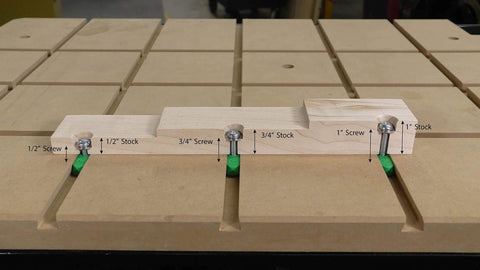 Wooden stock pieces secured with screws on a workbench demonstrating fitting for Half Inch By Fourteen Inch Two Step Plunge Router Bit.