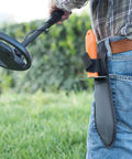 Person wearing the Prospector's Serrated Edge Digger Compact Shovel Trowel with belt loop sheath for gardening and metal detecting