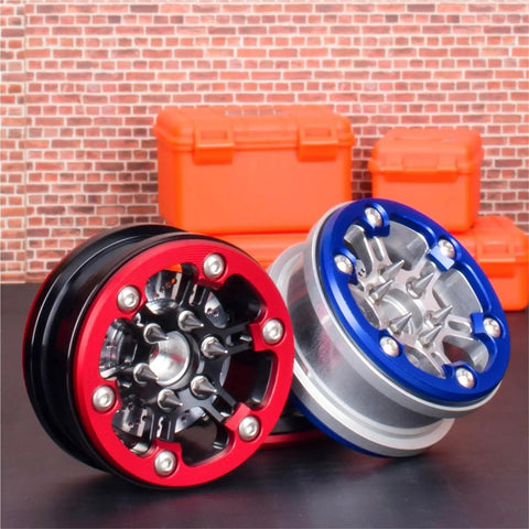 Beefed-Up RC Car Repair Kit With 24-Piece Hex Socket Screws, Spiked Hexagon Bolts And Screwdriver For SCX10 D90 And TRX4, Fits 1/10 And 1/8 Scale, Durable Metal Upgrade Parts For Secure Wheel Hubs And Suspension: close-up of red and blue RC wheel hubs with spiked bolts