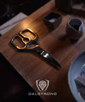 Ambidextrous Japanese Stainless Steel Kitchen Scissors For Spatchcocking Chicken, Trimming Fat, And Breaking Down Poultry, Also Great For Pizza, Flatbread, Herbs, Quesadillas, And Quick Package Opening, Detachable For Easy Cleaning. Black stainless kitchen scissors on wooden table