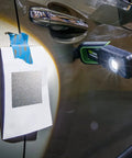 Rechargeable LED Color Match Inspection Light, 500 Lumen, CRI 95, Dual Color Temperatures 5000K and 3500K attached to car for paint check.