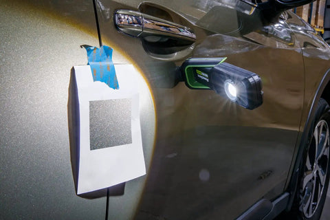 Rechargeable LED Color Match Inspection Light, 500 Lumen, CRI 95, Dual Color Temperatures 5000K and 3500K attached to car for paint check.