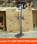 Beastly 13 Inch Floor Drill Press With 7.5 Amp 120V Pure Copper Motor, includes swing away safety guard in a workshop setting