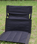 Ultra Lightweight Outdoor Camping Backrest Foldable Chair For Park And Beach Hangout Portable Single Lazy Chair With Aluminum Frame Easy One Step Setup Compact Carry Bag Carbon Black, unfolded on grass