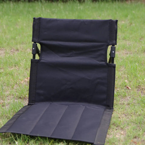 Ultra Lightweight Outdoor Camping Backrest Foldable Chair For Park And Beach Hangout Portable Single Lazy Chair With Aluminum Frame Easy One Step Setup Compact Carry Bag Carbon Black, unfolded on grass