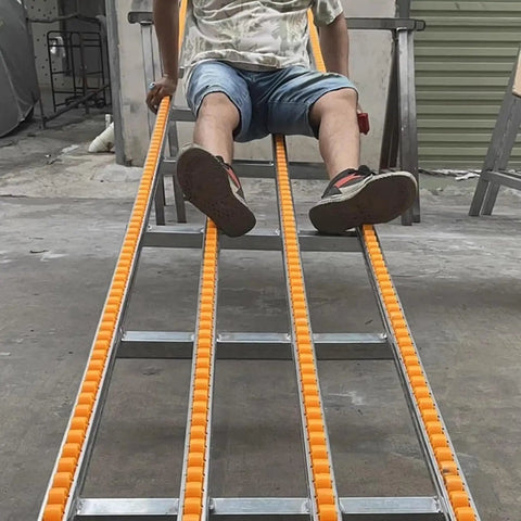 Light Duty Conveyor With ABS Roller System For Unpowered Spliced Truck Trailer Use In Warehouses Bucket Line Unloader 100 Cm Length 12 Inch Wide 30 Cm Frame Extendable Up To 300 Cm For The Warehouse Crew A Real Workhorse, shown with worker seated