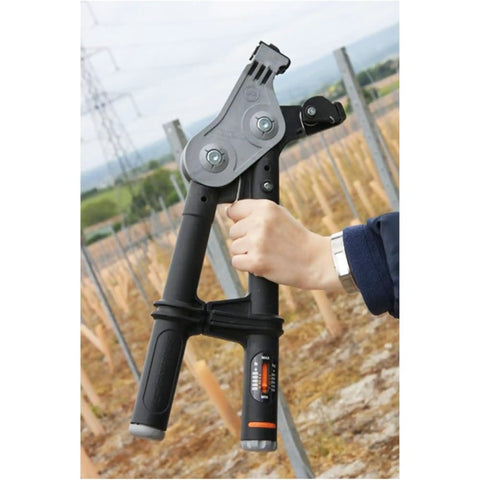 Person holding Torq Wire Tensioning Tool With Built In Gauge Tension Up To 880 Lbs in vineyard setting