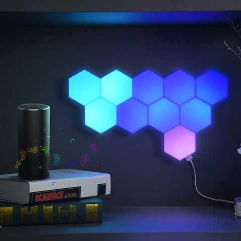 Lit Smart Hexagon LED Light Kit, 10 Pack WiFi Wall And Tabletop Blocks mounted on wall with colorful glow, Alexa nearby.