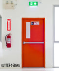 12 Pack Fire Extinguisher Arrow Down Decals 4x12 Inches Self Adhesive Weatherproof Vinyl High Visibility Safety Stickers For Home Office Boat Quick Locate Fire Equipment Signs That Stand Out In Smoke And Low Light on a wall above a fire extinguisher next to an orange door