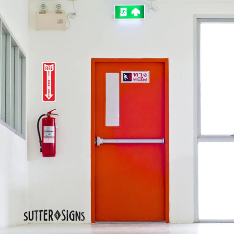 12 Pack Fire Extinguisher Arrow Down Decals 4x12 Inches Self Adhesive Weatherproof Vinyl High Visibility Safety Stickers For Home Office Boat Quick Locate Fire Equipment Signs That Stand Out In Smoke And Low Light on a wall above a fire extinguisher next to an orange door
