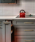 Modern kitchen with Five Inch 128mm Hole Centers Zinc Alloy Cabinet Pull In Champagne Bronze Finish on gray drawers and cupboards