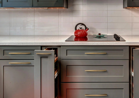 Modern kitchen with Five Inch 128mm Hole Centers Zinc Alloy Cabinet Pull In Champagne Bronze Finish on gray drawers and cupboards