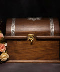 Vintage wooden box with gold-tone latch and floral decor, showcasing Retro Style Mini Hinges For Small Wooden Boxes And Jewelry Boxes.