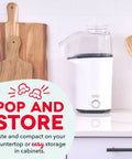 Fast 3 Minute Oil Free Hot Air Popcorn Maker 16 Cup Capacity Electric Popper Machine Crisp white finish on countertop with utensils.