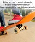 Person riding skateboard showcasing Skateboard Truck Hardware Kit With 8 Spacers 8 Axle Nuts And 40 Speed Rings For Skateboard And Longboard.